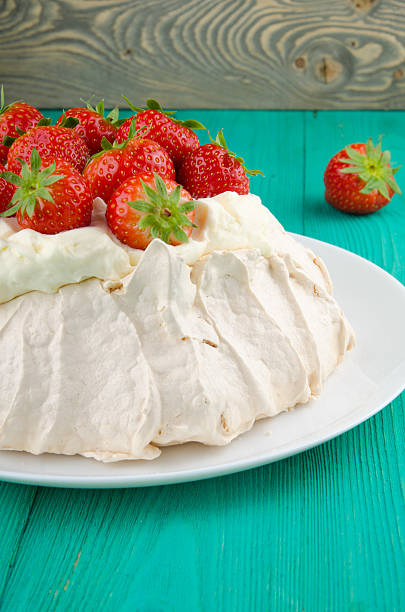 istock Pavlova cake with strawberry on rustic background. 584568658