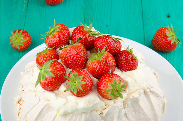 istock Pavlova cake with strawberry on rustic background. 584568704