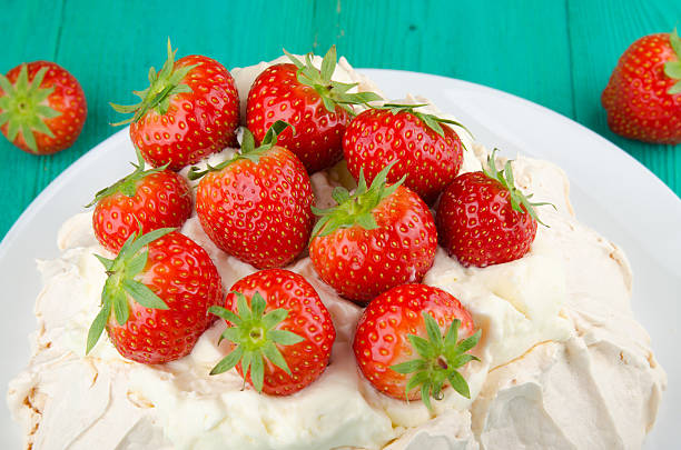istock Pavlova cake with strawberry on rustic background. 584568766