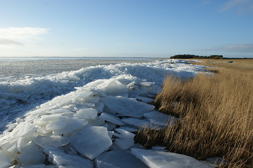 Pack ice next to a meadow in Jutland, Denmark.