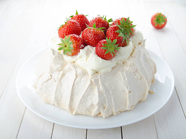 istock Pavlova cake with strawberry on rustic background 584570612