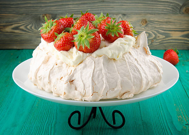istock Pavlova cake with strawberry on rustic background 584570664