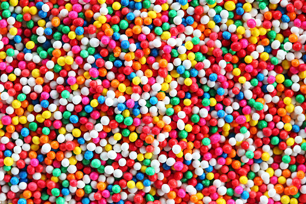 colorful sugar sprinkle background. colorful sugar sprinkle background. abundance stock pictures, royalty-free photos & images