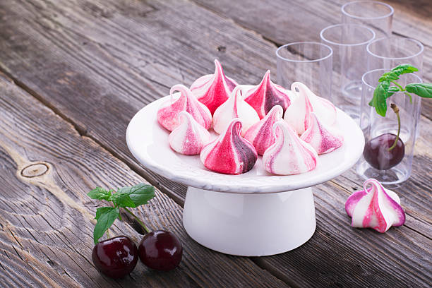 istock sweet handmade white red meringue swirls 584573102