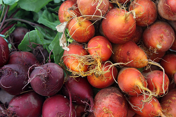 Golden and red beets make a colorful display at a Farmer's market