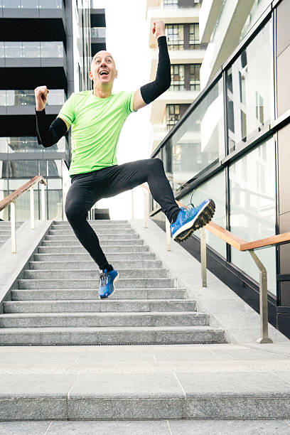istock Cheerful Man Running And Jumping 584574086