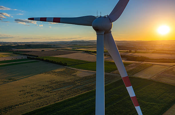 istock Sunset above the windmills on the field 584574682