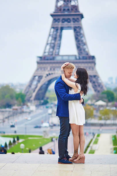 istock Romantic couple in Paris near the Eiffel tower 584575318