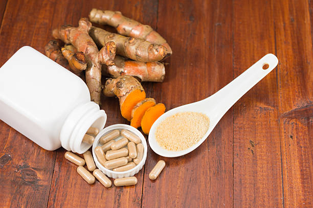 istock Turmeric herbal capsules in white bottle 584576894