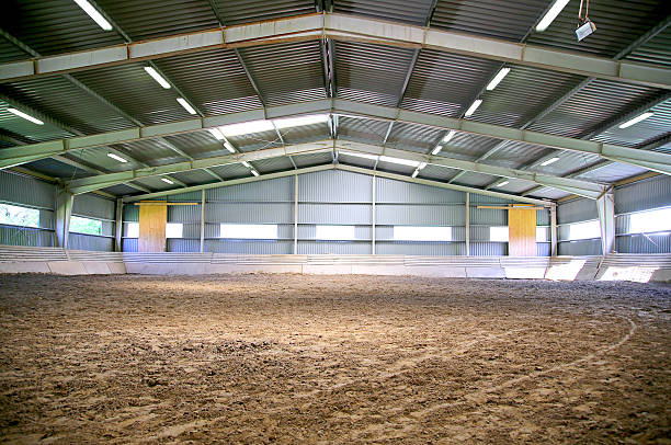 istock Riding hall with sandy covering without people 584579616