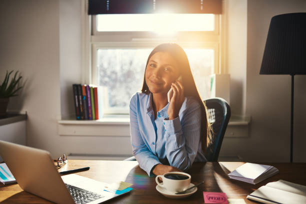 istock Female entrepreneur talking on the phone 584579704