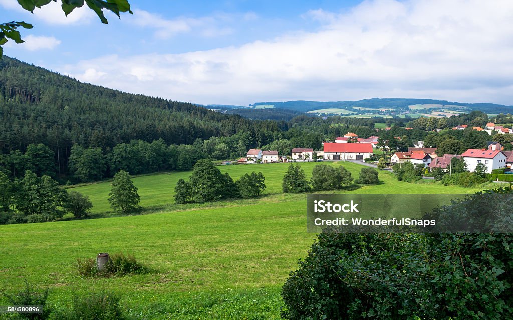 Village below the castle Velhartice Village below the castle Velhartice - landscape showing beautiful nature and small family houses. Blue Stock Photo