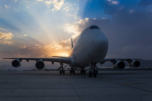 istock Passenger plane on taxiway at sunset 584581044