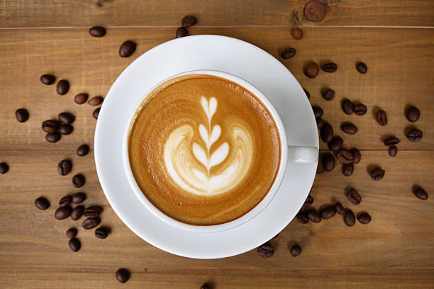 istock Coffee cup with on wooden table. View from the top 584583584