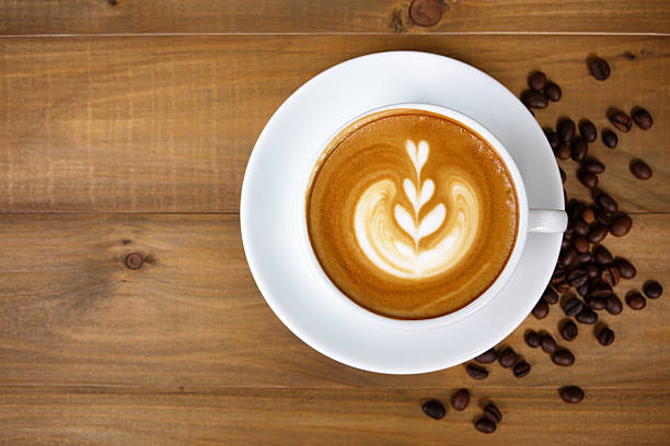 istock Coffee cup with on wooden table. View from the top 584583658