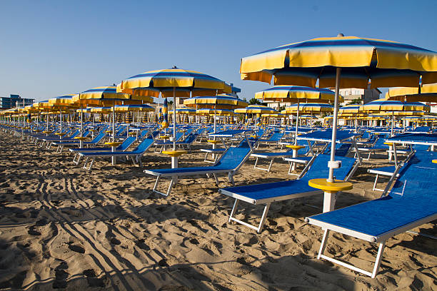 istock Adriatic beach umbrellas and sunbeds 584584020
