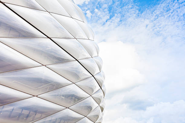 Allianz Arena Munich Munich, Germany - August 16, 2011: Detail of the facade of the soccer stadium "Allianz Arena" in Munich, Germany. The stadium has a 75,000 seating capacity. Widely known for its exterior of inflated ETFE plastic panels, it is the first stadium in the world with a full colour changing exterior. It is the second largest arena in Germany behind only Signal Iduna Park in Dortmund and home to FC Bayern Munich and TSV 1860 Munchen. allianz arena stock pictures, royalty-free photos & images