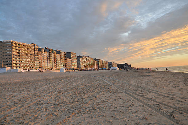 Middelkerke – Sunset at the North Sea coast (Middelkerke) - beach promenade, ocean, hotels and sand at an cloudy evening
