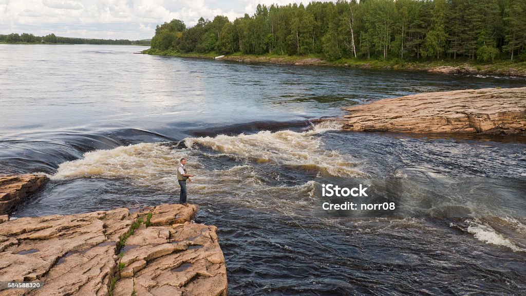 fishing in Scandinavia Fishing in the north of Scandinavia, Juoksengi Adult Stock Photo