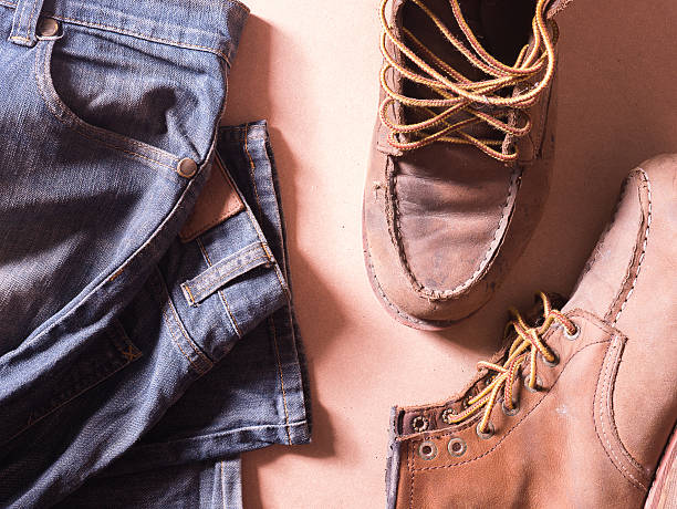 istock blue jean with still life of old leather boots, 584590746