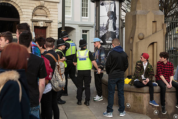 Police questioning young man in Birmingham city centre stock photo