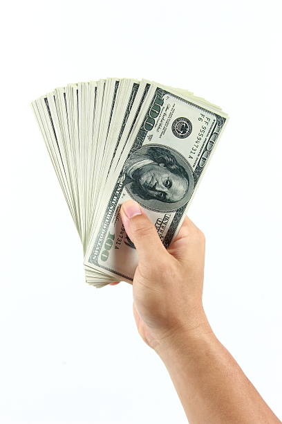 istock American money in hand 584593360