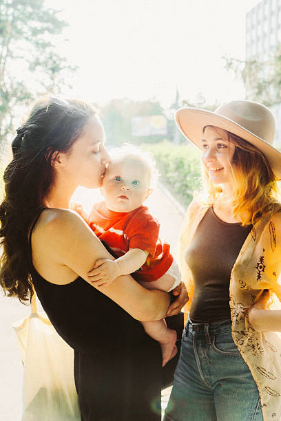 istock Two young women with baby 584593384