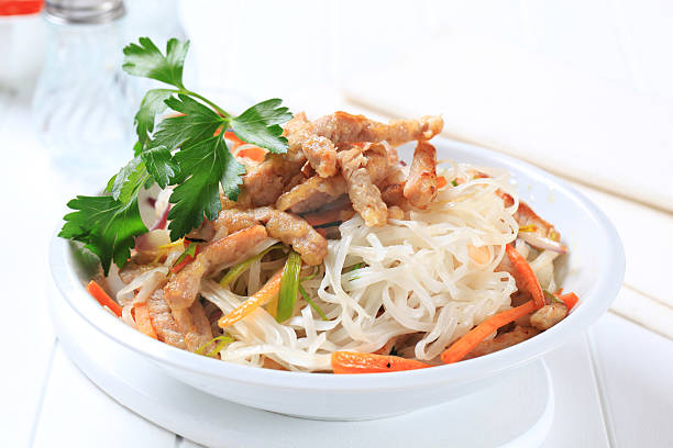 istock rice noodles with meat and vegetables 584593522