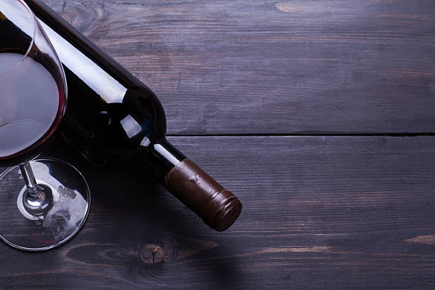 istock Red wine on dark wood 584594044