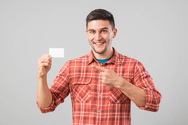 istock Man showing blank business card 584594814