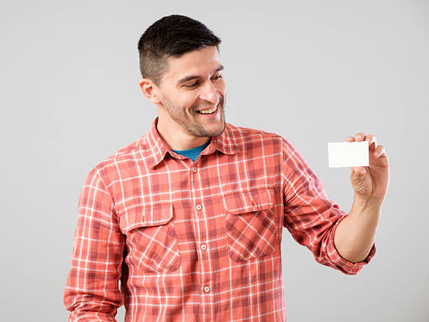 istock Man showing blank business card 584594910