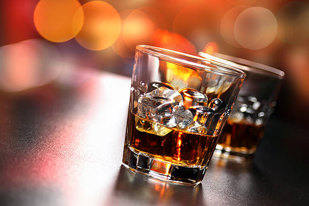 Glasses of whiskey on the bar