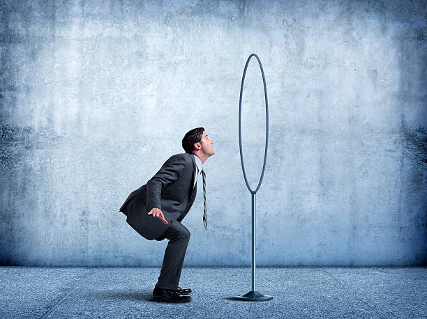 istock Businessman About To Jump Through A Hoop 584596908