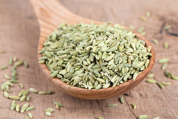 istock fennel seed in a wooden spoon on table 584597738