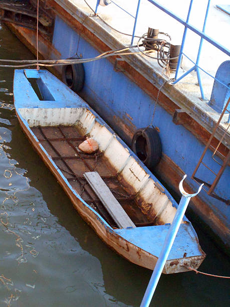 istock Old boat moored on the old quay 584597872