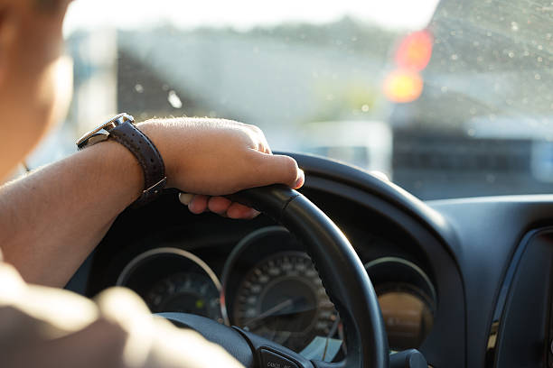 Man behind the wheel in the evening.