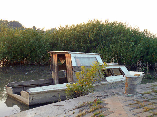 istock Old boat moored on the old quay 584597990