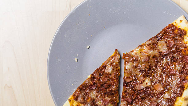 istock Tasty meat pizza bread close up 584600978