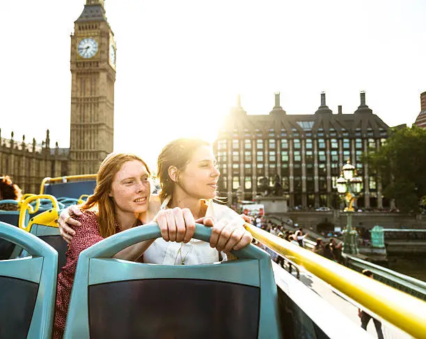 lesbian couple of tourist take a tour in London