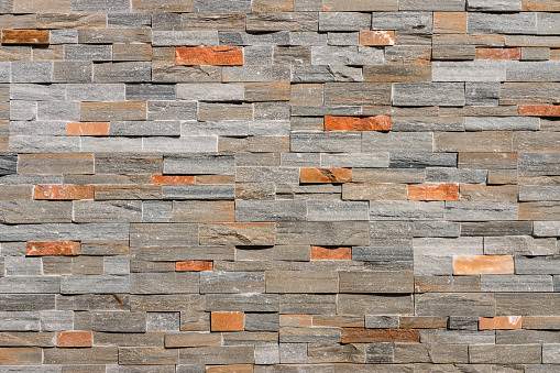 closeup of natural stone wall cladding background