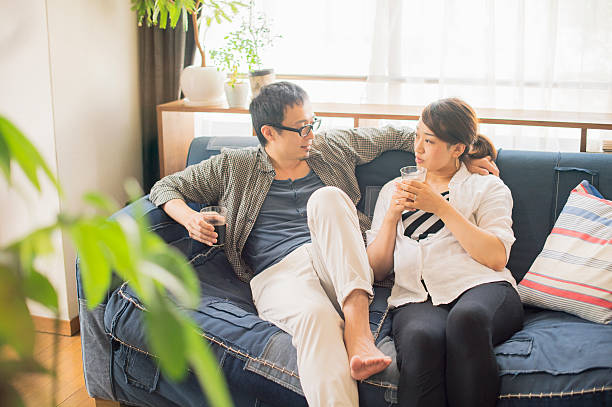 istock Couple relaxing at home on holiday 584607232