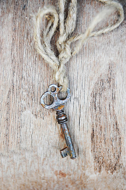 istock Vintage key on wooden background 584607884