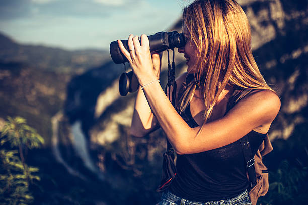 istock Pretty girl with binoculars 584608284