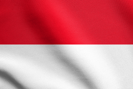Flag of Indonesia, Monaco, Hesse (Germany) waving in the wind with detailed fabric texture. Indonesian national flag.