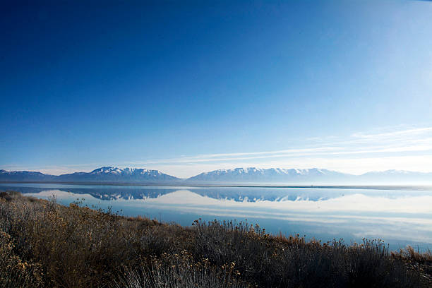 rocky mountain reflecting in the great salt lake off the coast of antelope island