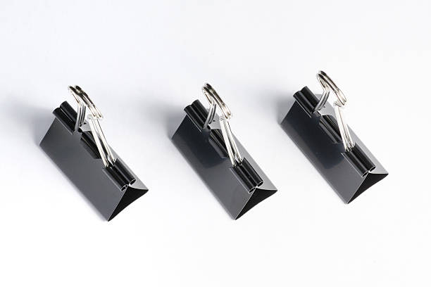 istock Black paper clip isolated on white 584612424
