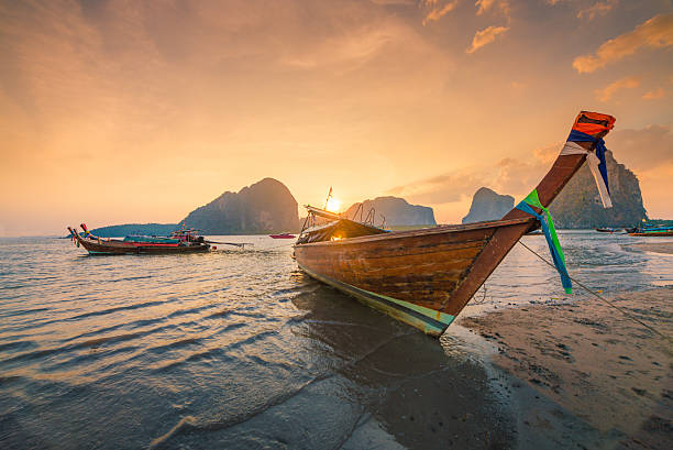 istock Beautiful sunset at tropical beach in asia thailand 584612882