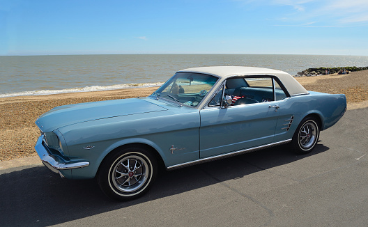 Felixstowe, Suffolk, England - May 01, 2016: Classic Blue Ford Mustang motor car parked on  Felixstowe seafront promenade.