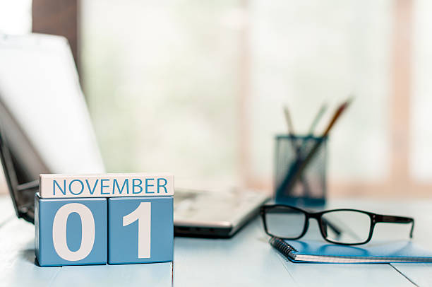 November 1st. Day 1 of month, calendar on teacher workplace November 1st. Day 1 of month, calendar on teacher workplace background. Autumn time. Empty space for text. calendar today personal organizer routine stock pictures, royalty-free photos & images