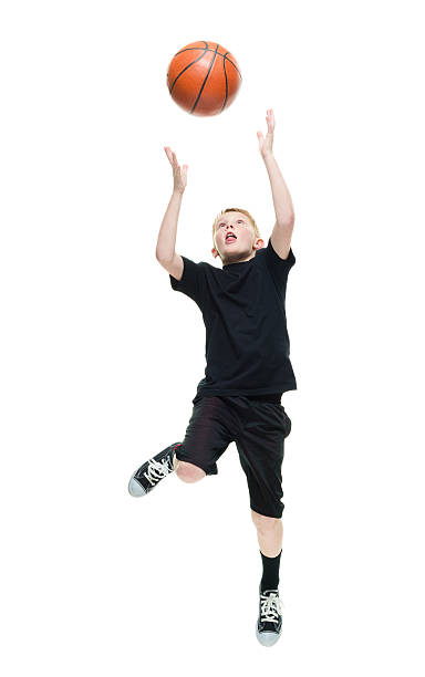 istock Little boy playing with basketball 584748408